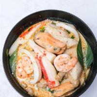 Tom Kha Soup · Thai creamy coconut soup with mushroom, lemongrasses, galangal and kaffir lime leaves. Toppe...