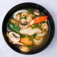 Tom Yum Soup · Thai hot and sour soup with mushroom, onion, lemongrass and kaffir lime leaves. Topped with ...