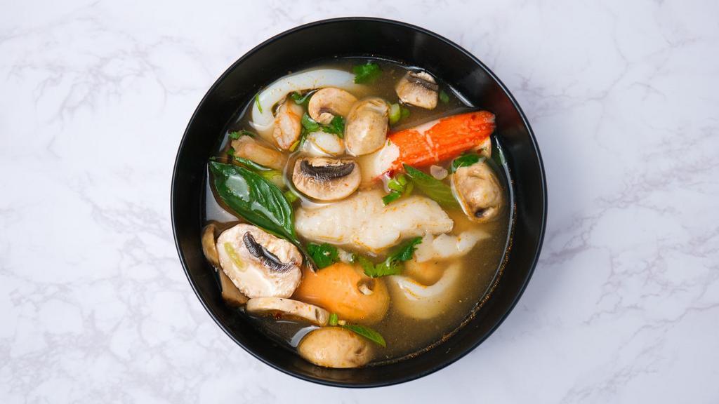 Tom Yum Soup · Thai hot and sour soup with mushroom, onion, lemongrass and kaffir lime leaves. Topped with cilantro.(For a better price please give us a call to order) 32oz