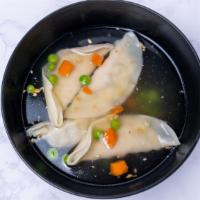 Wonton Soup · Chicken wonton soup with pea and carrot, bok choy and topped with cilantro in clear chicken ...