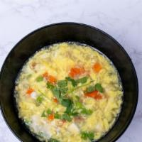 Egg Drop Soup · Egg, tofu, sweet pea, diced carrots and green onion in chicken broth.(For a better price ple...