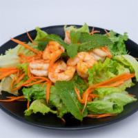 Shrimp Salad · Smoky grilled shrimp tossed with onion, mint leaves, cilantro and dried chili powder. Served...