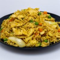 Curry Fried Rice · Pan fried jasmine rice with your choice of protein, egg,  onion, peas carrots and yellow cur...