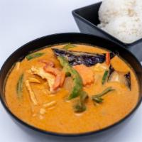 Red Curry · Simmered in red curry paste in coconut milk with eggplants, bell pepper, bamboo shoot, green...