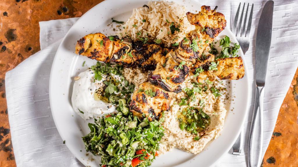 Chicken Kabob · Marinated in yogurt, saffron, and spices. Grilled and served with lebne, hummus, tabbouleh salad, and rice.