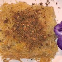 Knafeh · Sweet cheese topped with saffron shredded phyllo dough.