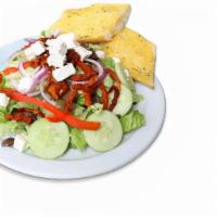 Greek Salad · Served with garlic bread. Romaine lettuce, red onions, Greek olives, red bell peppers, sundr...