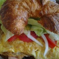 Croissant Sandwich · Mayonnaise, tomato, onions, lettuce, avocado, jalapeño and your choice of ham and cheese, eg...