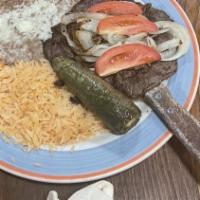 Carne Asada · Citrus Marinated grilled steak, served with grilled jalapeños and onions (choice of corn or ...