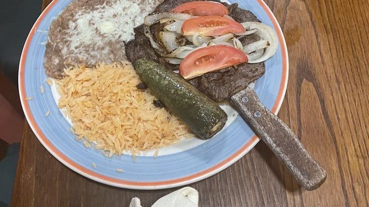 Carne Asada · Citrus Marinated grilled steak, served with grilled jalapeños and onions (choice of corn or flour tortillas).