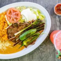 Carne Asada Plate · Two slices of thin steak with green onions, grilled jalapeÃ±os. Served with rice and beans, ...