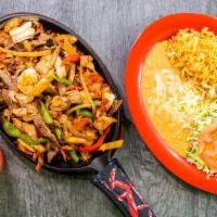 Fajitas Cielo Mar Y Tierra · Chicken, beef strips and shrimp with green bell peppers, tomatoes, onions. Served with rice ...