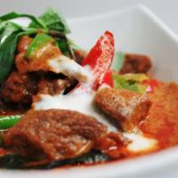 Panang Curry · Your choice of meat with bell peppers, carrots, zucchini, green beans & basil in our special...