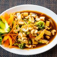 Pad Thai · Pan-fried thin rice noodles, tofu, egg, bean sprouts, carrots, green onions topped with crus...