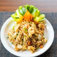 Thai Fried Rice (Khao Pad) · Choice of meat, fried rice with egg, diced tomato, peas, diced carrots and white onions.