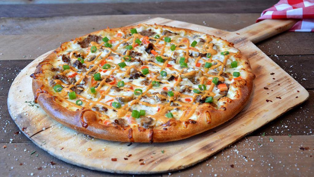 Philly'S Finest · Grilled sirloin, caramelized onions, diced red peppers, sautéed mushrooms, green onions, mozzarella cheese, Pale Ale queso and chipotle aioli.