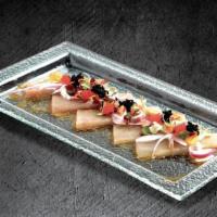 Albacore Carpaccio · Albacore sashimi, kizami wasabi, red onion, sea salt, tobiko, and ponzu.