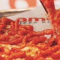 Hot Cheetos Pizza · Cheese pizza topped with hot Cheetos.