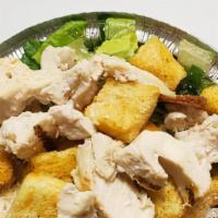 Grilled Chicken Caesar Salad · Chicken breast, Romaine lettuce, shredded Parmesan, croutons and Caesar dressing.