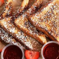 French Toast · Caramelized‎ banana, mixed berries, maple syrup, and powdered sugar.
