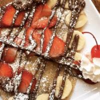 Nutella Crepe · Banana or strawberry, powdered sugar, and whip cream.