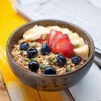 Pumpkin Seed Granola · low fat yoghurt, strawberries, banana, toasted almonds