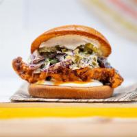 Buffalo Chicken Sandwich · country fried chicken breast tossed in buffalo sauce, slaw, lemon-herb mayo, pickles, brioch...