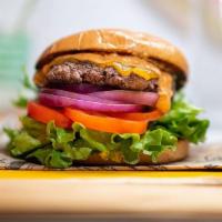 Signature Burger · 6oz burger, romaine, tomato, onion, cheebo sauce, cheddar, brioche bun.  Served medium.