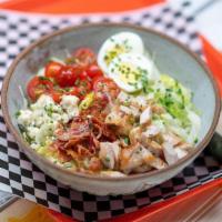 Cobb Iceberg Lettuce Wedge · grilled chicken, tomatoes, blue cheese crumbles, bacon, chives, egg, blue cheese dressing (o...