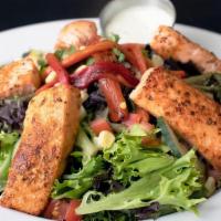 Salmon Salad · Juicy grilled blackened fillet of salmon served over mixed greens. Topped with roasted red p...