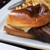 Prime Rib Sandwich · Slow-cooked Prime Rib topped with Monterey jack cheese, caramelized peppers and onions with ...
