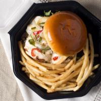 Santa Fe Chicken Sandwich · Grilled chicken breast topped with Monterey jack cheese, caramelized peppers and onions, sli...