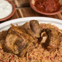 Lamb Kabsa · Lamb cooked with vegetables, kabsa mixed spices, served with yogurt cucumber and spicy sauce.