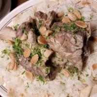 Mansaf · Lamb cooked in a sauce of fermented dried yogurt and served with rice.
