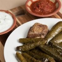 Grape Leaves · Grape leaves stuffed with rice and meat .