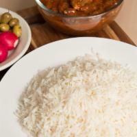 Bamia · Fresh okra cooked with lamb, garlic, onion, coriander and tomato sauce and severed with rice.