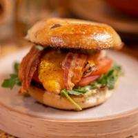 Grilled Chicken Bagel Sandwich · cheddar, bacon, tomato, arugula, lemon herb aioli, bagel