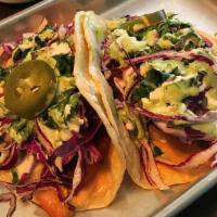 Oyster Tacos · Two soft tacos with fried, slightly spicy oyster mushrooms topped with red cabbage, fresh to...