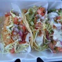 Taco De Camarón / Shrimp Taco · Con repollo, crema, pico de gallo y salsa. / Served with cabbage, sour cream, pico de gallo ...