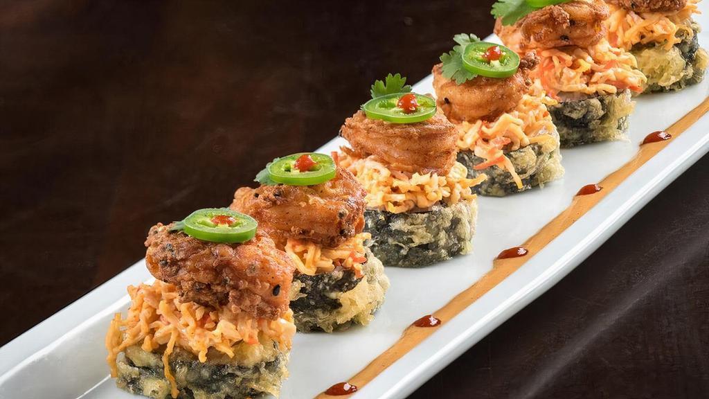 Chili Shrimp Roll · Krab† and cream cheese rolled and lightly tempura battered, topped with spicy krab† mix, crispy shrimp, cilantro and jalapeño; served with spicy mayo and Sriracha