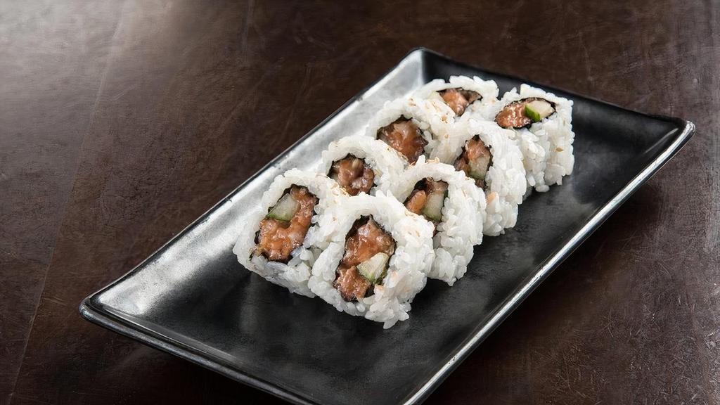 Spicy Salmon Roll · Fresh salmon* and Sriracha, combined with cucumber and rolled in seaweed and rice