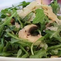 Arugula Salad · Gluten-free. Baby organic arugula, thinly sliced mushrooms, and shaved parmigiano with citro...