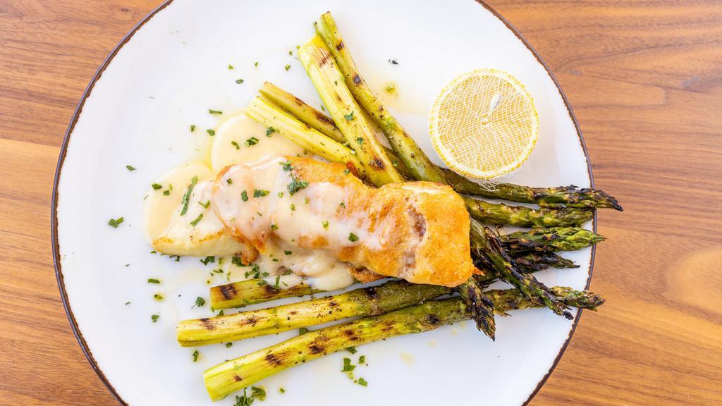 Parmigiano Crusted Halibut · Gluten-free. Grilled asparagus and beurre blanc.