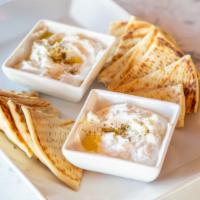 Labneh Dip · Labneh Dip
Creamy labneh, zá atar and olive oil. Served with toasted garlic or original pita.
