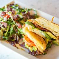 Turkey Club · Turkey Club
Sliced turkey, avocado, bacon, lettuce, tomato and a garlic aioli on ciabatta br...