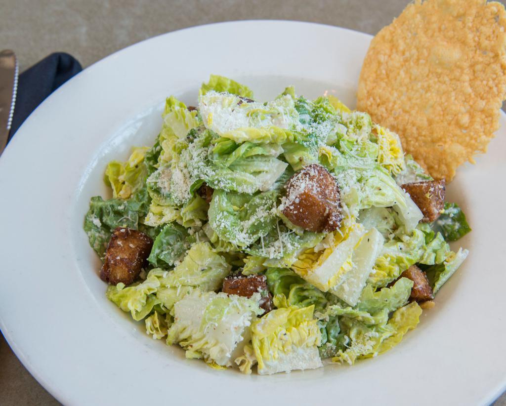 Little Gem Caesar · 450 cal little gem lettuce, garlic croutons, parmesan cheese crisp, white anchovy, caesar dressing with roasted chicken 660 cal for an additional charge / with wild salmon 630 cal for an additional charge
