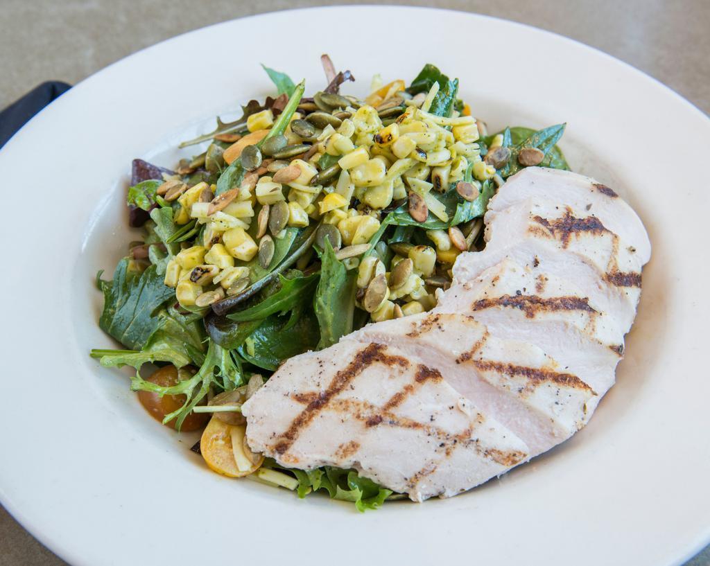 Cilantro Lime Chicken · Gluten free 490 cal organic baby greens, jack cheese, heirloom tomatoes, grilled corn, pumpkin seeds,  cilantro lime vinaigrette, grilled chicken