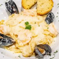 Seafood Cream Pasta
 · Alfredo style sauce, contains Shrimp, Mussels and Calamari. Served with 1 piece of garlic br...