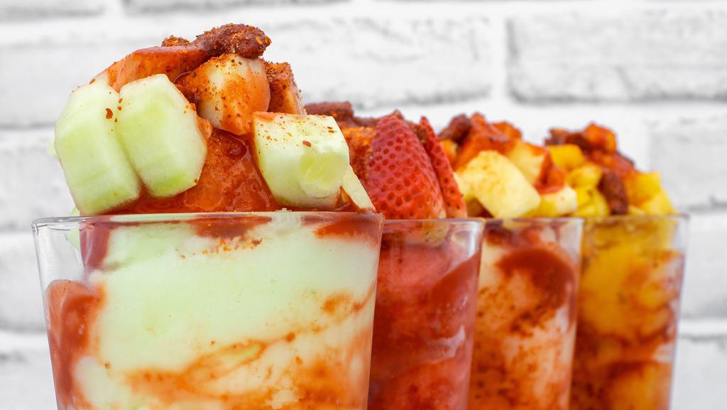Fruit Freeze (Mangonada, Fresada, Pepinada, Pinada) · Fruit freeze, diced fruit depending on which one picked, chamoy, tajin, tamarind candies, and a tamarind stick. Please choose what kind you want. price for small size