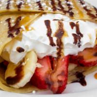 Crepe · Crepe comes with strawberries, banana, whipped cream, chocolate drizzle, and powder sugar.